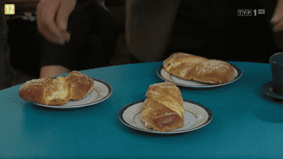 Three Croissants On Plates With TVP Logo GIF