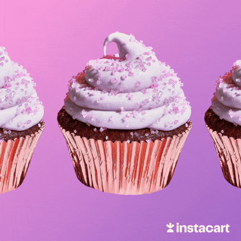 Three Cupcakes With Pink Frosting And Sprinkles On A Pink Background With Instacart In The Bottom Right Corner GIF