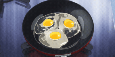 Three Eggs Are Cooking In A Pan On A Stove GIF