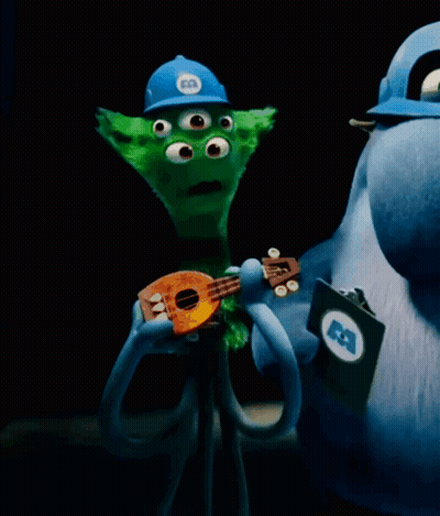 Three-Eyed Cartoon Character Holding Guitar GIF
