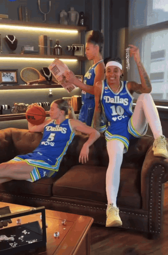Three Female Dallas Basketball Players Sitting GIF