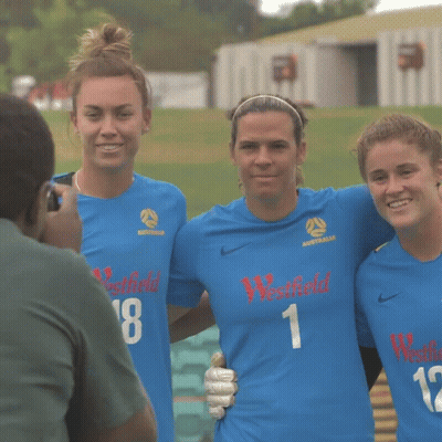 Three Female Soccer Players Wearing Blue Westfield Jerseys Pose For A Photo GIF