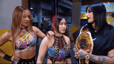 Three Female Wrestlers, One With Championship Belt GIF