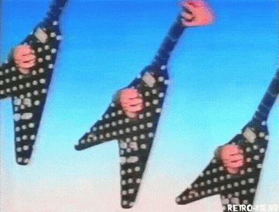 Three Flying V Guitars With Skulls GIF