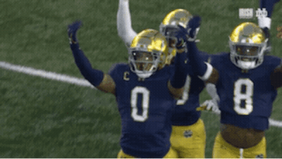 Three Football Players In Jerseys 29 0 And 8 GIF