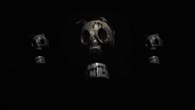 Three Gas Masks Are Sitting Next To Each Other On A Black Background . GIF