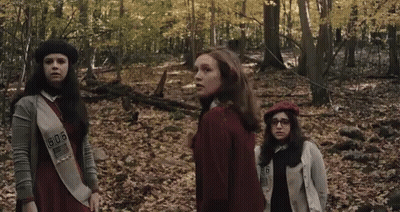 Three Girl Scouts In Woods With Number 506 On Sash GIF