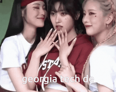 Three Girls Are Posing For A Picture And One Has Georgia Tech On Her Shirt GIF