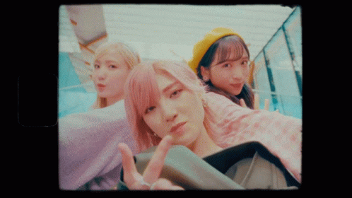 Three Girls Are Posing For A Picture And One Is Wearing A Yellow Hat GIF