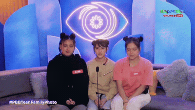 Three Girls Sitting On Couch In Front Of Large Eye #Pbbteenfamilyphoto GIF