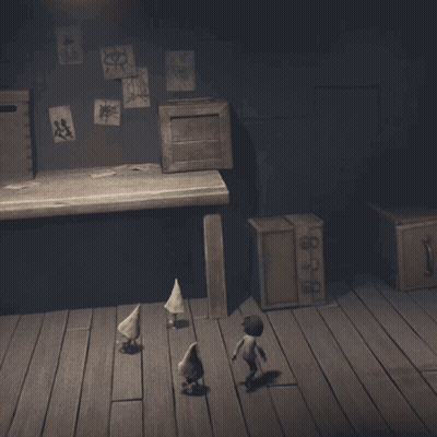 Three Gnomes Standing On Wooden Floor In Dark Room GIF