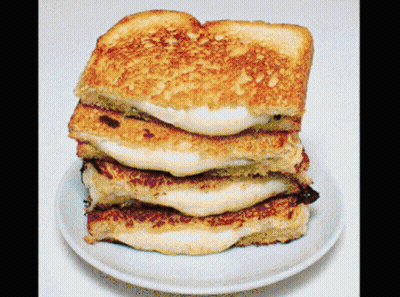 Three Grilled Cheese Sandwiches Stacked GIF