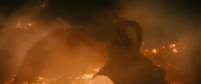 Three-Headed Dragon Flying Through Foggy Forest GIF