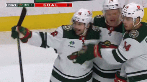 Three Hockey Players Are Celebrating A Goal With The Tsn Logo In The Background GIF