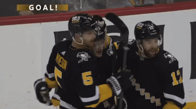 Three Hockey Players Celebrating Goal With Number 6 GIF