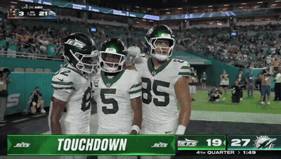 Three Jets Football Players Celebrate Touchdown GIF