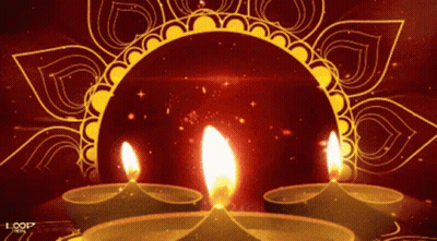 Three Lit Candles on Red Background