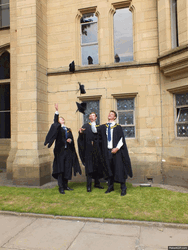Three Man Throwing Graduation Hats GIF