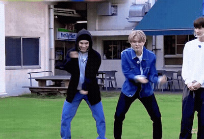 Three Men Are Dancing In Front Of A Family Mart Store GIF