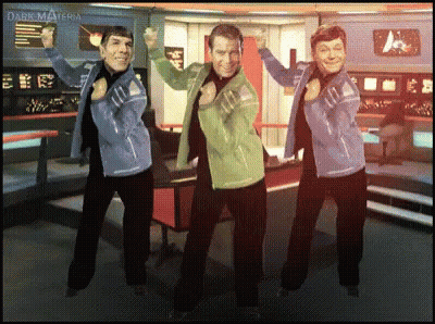 Three Men Are Dancing In Front Of A Wall That Says Dark Materia On It GIF