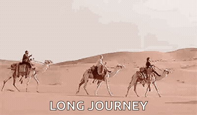 Three Men Are Riding Camels Through The Desert . GIF