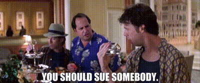 Three Men Are Sitting At A Table And One Of Them Is Holding A Glass And Says You Should Sue Somebody . GIF