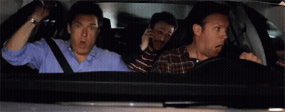 Three Men Are Sitting In A Car With Their Mouths Open And One Of Them Is Screaming . GIF