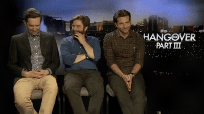 Three Men Are Sitting In Front Of A Hangover Part Iii Sign GIF
