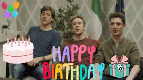 Three Men Are Sitting On A Couch With A Birthday Cake And The Words Happy Birthday Behind Them GIF