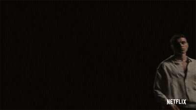 Three Men Are Standing In A Dark Room With Netflix Written On The Bottom Right GIF