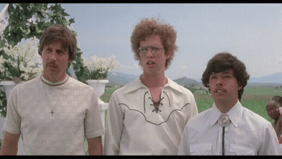 Three Men Are Standing In A Field And One Of Them Is Wearing A Cowboy Shirt GIF