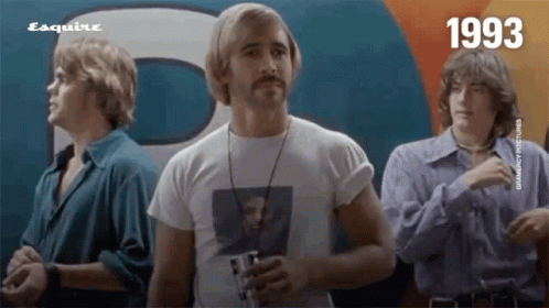Three Men Are Standing In Front Of An Esquire Logo GIF