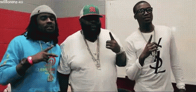 Three Men Are Standing Next To Each Other And One Of Them Has A Ysl T-Shirt On GIF
