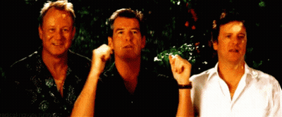 Three Men Are Standing Next To Each Other And One Of Them Is Pointing At Something . GIF