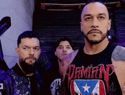 Three Men Are Standing Next To Each Other In A Room . GIF