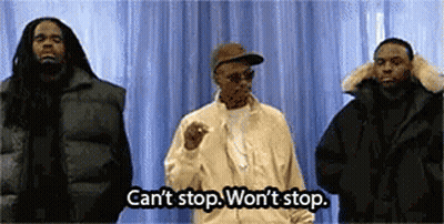 Three Men Are Standing Next To Each Other In Front Of A Blue Curtain . GIF