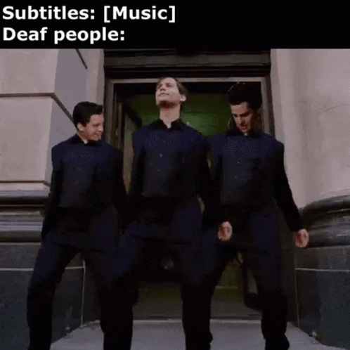 Three Men Are Standing Next To Each Other In Front Of A Building And Dancing . GIF
