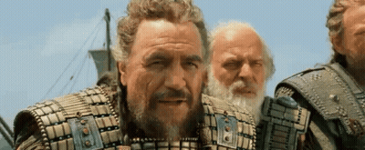 Three Men Are Standing Next To Each Other On A Boat . GIF