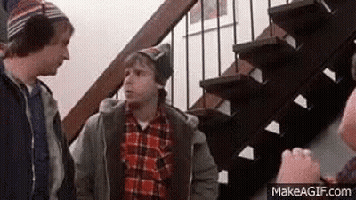 Three Men Are Standing Next To Each Other On A Set Of Stairs Talking To Each Other . GIF