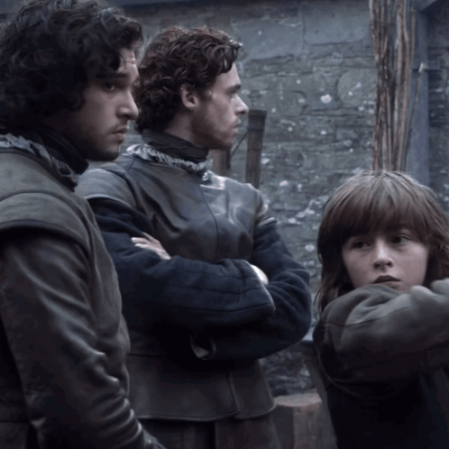 Three Men Are Standing Next To Each Other With Their Arms Crossed And One Of Them Is A Little Girl GIF