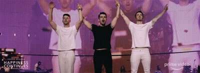 Three Men Arms Up Stage Happiness Continues GIF