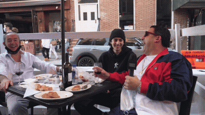 Three Men At Table With Food And Wine GIF
