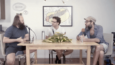 Three Men At Table With Hot Dog Picture GIF