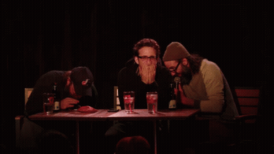Three Men At Table With Yellow Unscoop Text GIF