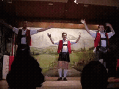 Three Men Dancing On Stage GIF