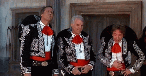 Three Men Dressed In Mariachi Costumes Are Standing Next To Each Other GIF