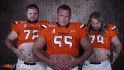 Three Men In Camels Football Jerseys Posing GIF