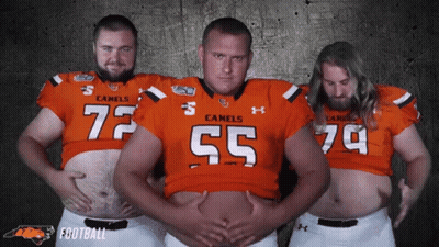 Three Men In Camels Football Jerseys Posing GIF