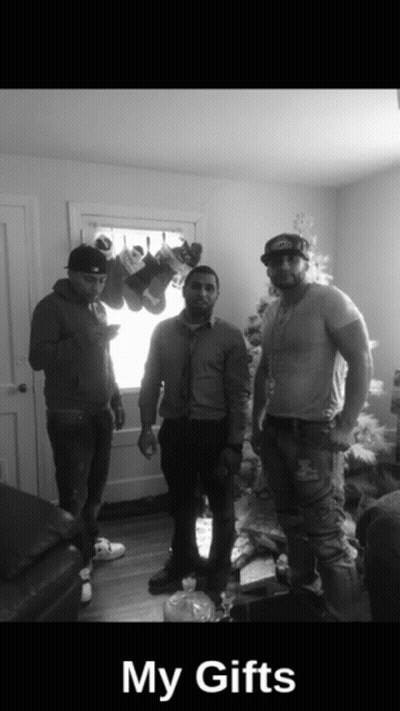 Three Men In Front Of Christmas Tree Saying My Gifts GIF