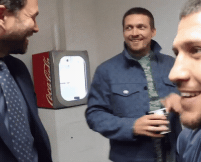 Three Men In Front Of Coca Cola Fridge GIF